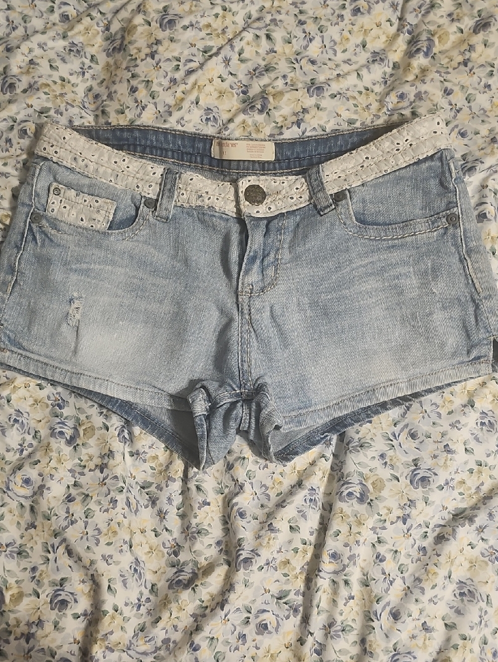 No Boundaries Light Wash Denim Shorts with White Eyelet Trim